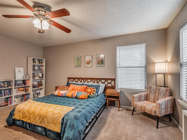 2104 Tanglewood Dr, Edmond, OK 73013 - bedroom featuring carpet, ceiling fan, and a textured ceiling