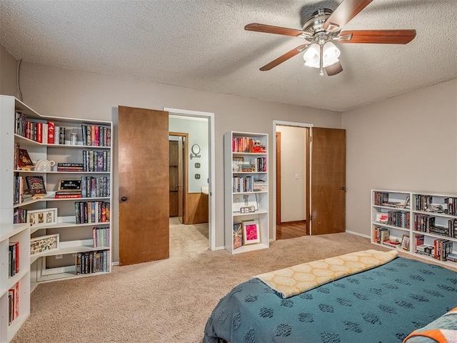 2104 Tanglewood Dr, Edmond, OK 73013 - carpeted bedroom with a textured ceiling and a ceiling fan