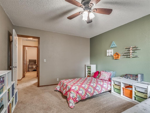 2104 Tanglewood Dr, Edmond, OK 73013 - bedroom with light carpet, a textured ceiling, and a ceiling fan