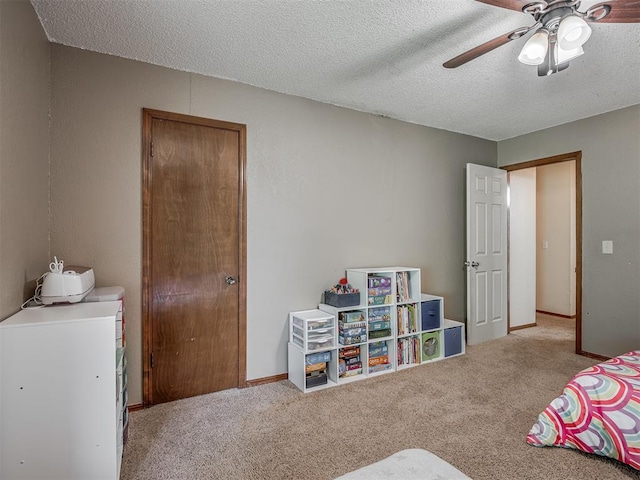 2104 Tanglewood Dr, Edmond, OK 73013 - bedroom featuring washer and clothes dryer, carpet flooring, a ceiling fan, and a textured ceiling