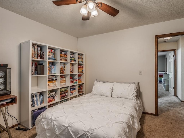 2104 Tanglewood Dr, Edmond, OK 73013 - carpeted bedroom featuring a textured ceiling and ceiling fan