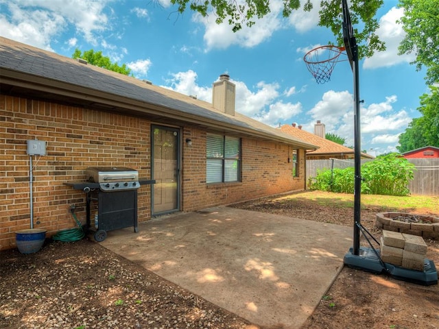 2104 Tanglewood Dr, Edmond, OK 73013 - view of patio with a grill and a fire pit