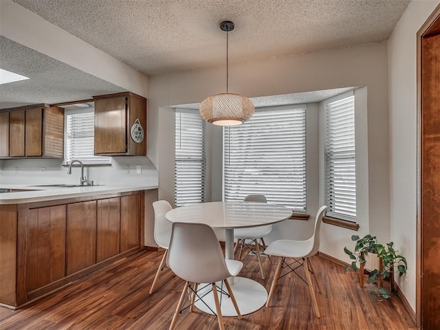 2104 Tanglewood Dr, Edmond, OK 73013 - dining room featuring dark wood-type flooring and a textured ceiling