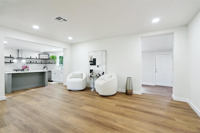 8300 S Anderson Rd, Oklahoma City, OK 73150 - living area with light wood finished floors and recessed lighting