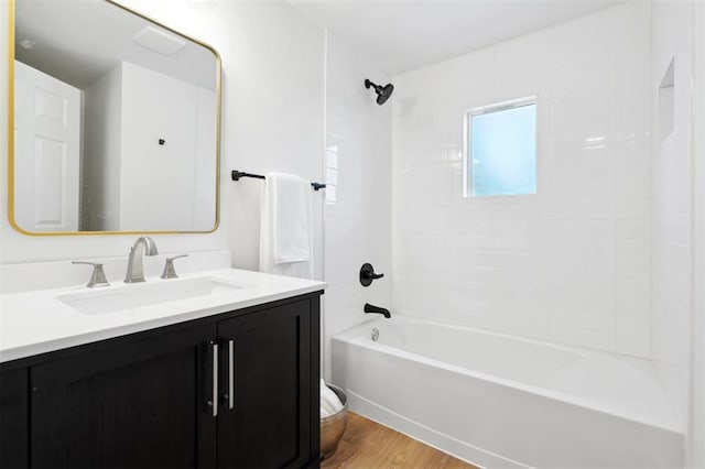 8300 S Anderson Rd, Oklahoma City, OK 73150 - full bath featuring vanity, wood finished floors, and bathtub / shower combination