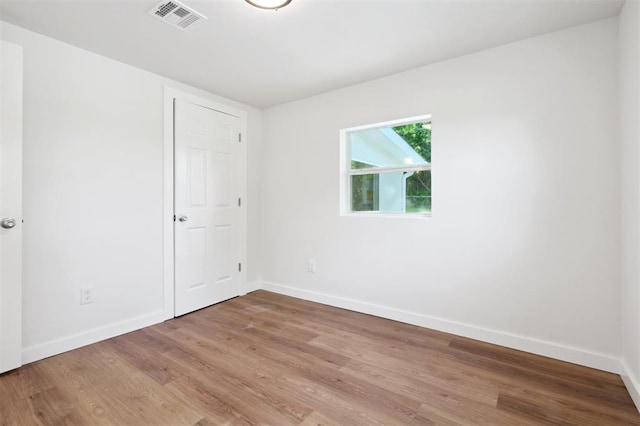 8300 S Anderson Rd, Oklahoma City, OK 73150 - spare room featuring baseboards and light wood-style floors