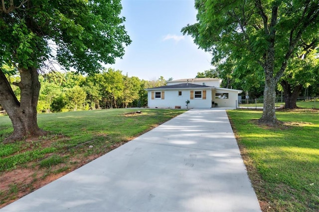 8300 S Anderson Rd, Oklahoma City, OK 73150 - view of front of house featuring concrete driveway and a carport