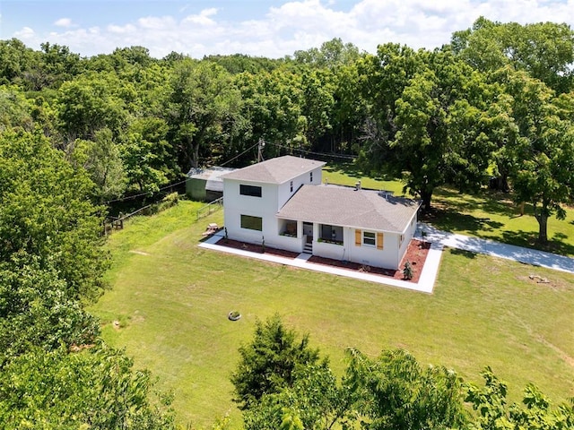 8300 S Anderson Rd, Oklahoma City, OK 73150 - aerial view of property and surrounding area with a heavily wooded area
