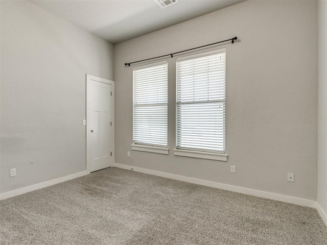 6713 NW 149th St, Oklahoma City, OK 73142 - carpeted empty room with plenty of natural light