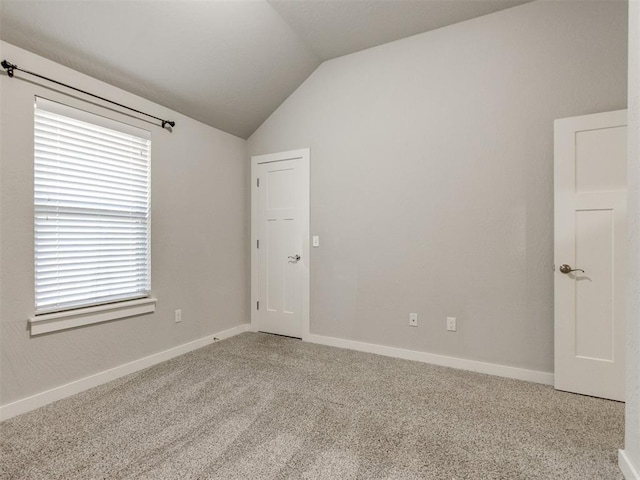 6713 NW 149th St, Oklahoma City, OK 73142 - empty room with vaulted ceiling and carpet floors