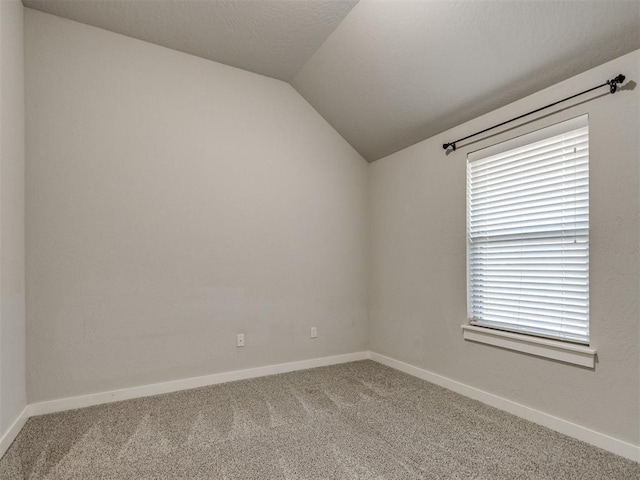6713 NW 149th St, Oklahoma City, OK 73142 - carpeted empty room with vaulted ceiling and plenty of natural light