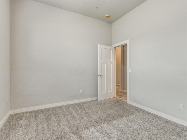 6713 NW 149th St, Oklahoma City, OK 73142 - carpeted spare room featuring baseboards