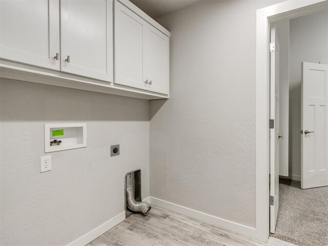 6713 NW 149th St, Oklahoma City, OK 73142 - laundry area featuring hookup for an electric dryer, cabinet space, washer hookup, and light wood finished floors
