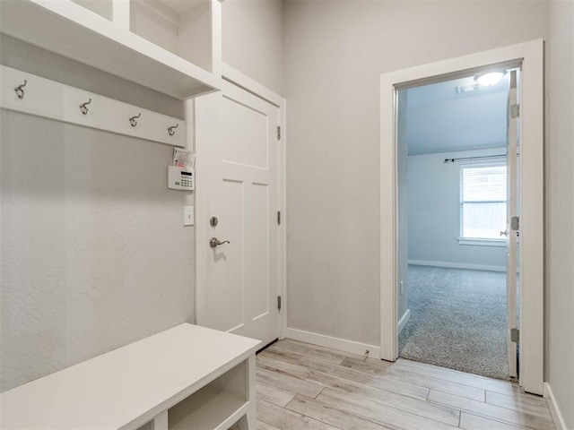 6713 NW 149th St, Oklahoma City, OK 73142 - mudroom with light wood-style floors and baseboards