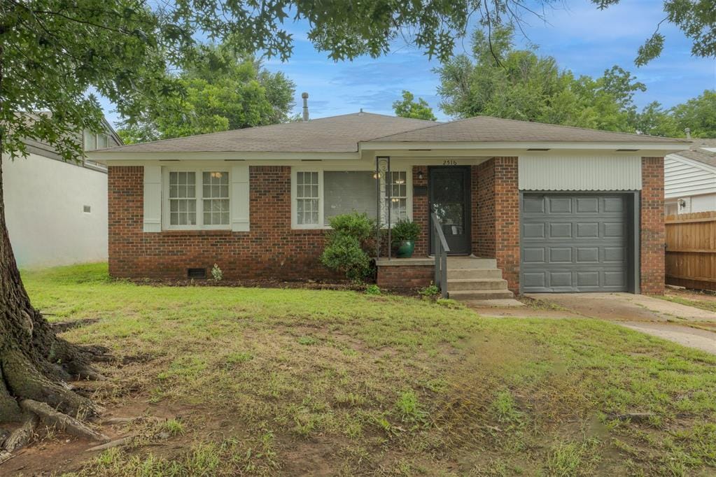 2516 NW 33rd St, Oklahoma City, OK 73112 - ranch-style home with an attached garage, driveway, brick siding, and roof with shingles
