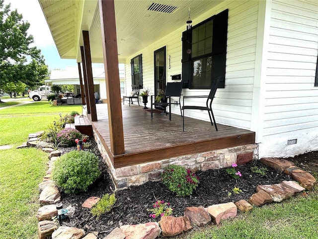 213 W 5th St, Stroud, OK 74079 - wooden porch with a lawn