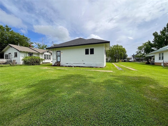 213 W 5th St, Stroud, OK 74079 - rear view of house featuring a lawn and crawl space