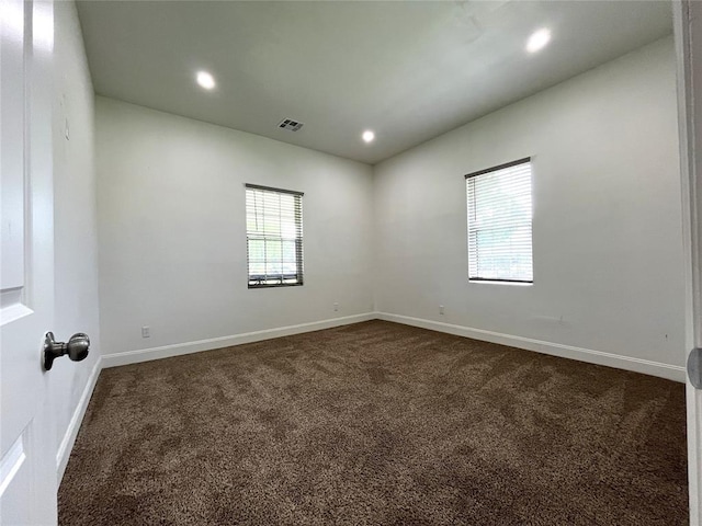 213 W 5th St, Stroud, OK 74079 - empty room featuring dark carpet and recessed lighting