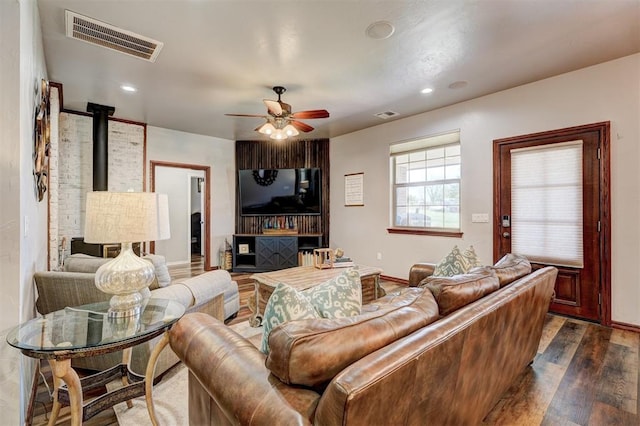 1187 County St Unit 2976, Blanchard, OK 73010 - living area featuring dark wood-type flooring, ceiling fan, a wood stove, and recessed lighting