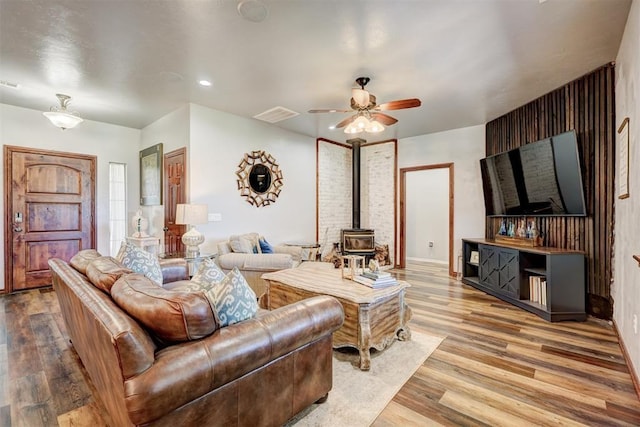 1187 County St Unit 2976, Blanchard, OK 73010 - living room with a wood stove, wood finished floors, a ceiling fan, and recessed lighting
