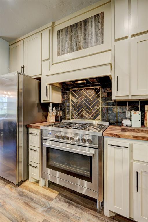 1187 County St Unit 2976, Blanchard, OK 73010 - kitchen featuring stainless steel appliances, butcher block counters, and light wood finished floors