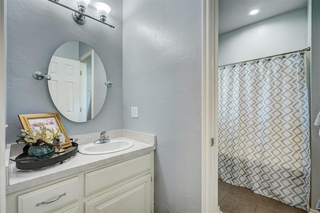 1187 County St Unit 2976, Blanchard, OK 73010 - full bath with vanity, tile patterned floors, a shower with shower curtain, and a textured wall