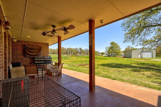1187 County St Unit 2976, Blanchard, OK 73010 - view of patio featuring grilling area, a garage, a ceiling fan, and an outbuilding