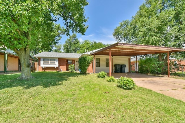 5505 S Dimple Dr, Oklahoma City, OK 73135 - view of front of home with brick siding, concrete driveway, and a carport
