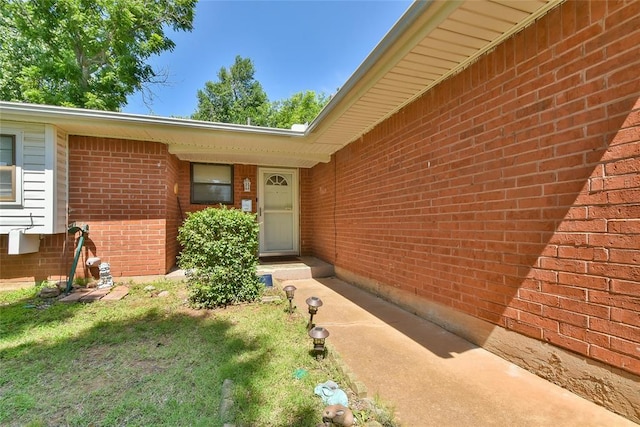 5505 S Dimple Dr, Oklahoma City, OK 73135 - doorway to property featuring brick siding
