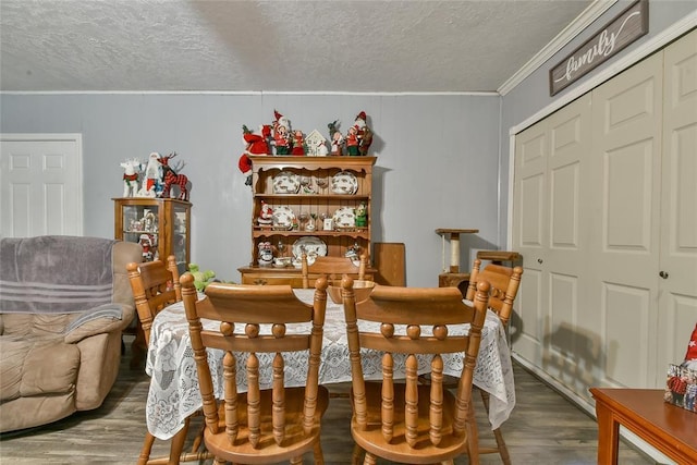 5505 S Dimple Dr, Oklahoma City, OK 73135 - dining room featuring ornamental molding, wood finished floors, and a textured ceiling