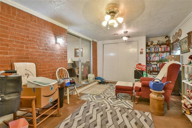 5505 S Dimple Dr, Oklahoma City, OK 73135 - living area with a textured ceiling, brick wall, and ornamental molding
