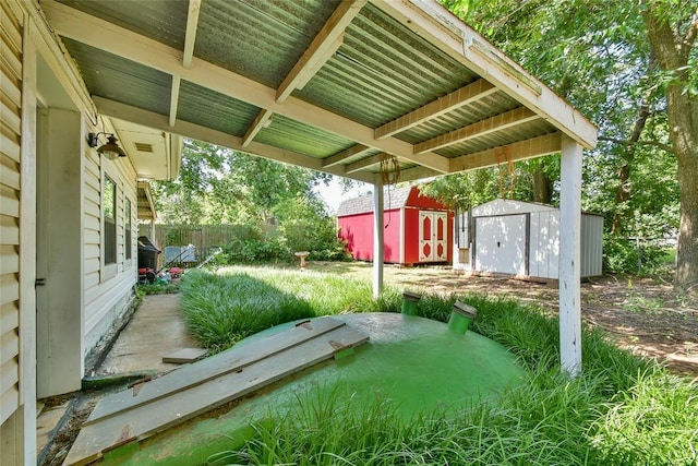 5505 S Dimple Dr, Oklahoma City, OK 73135 - view of yard with a storage unit