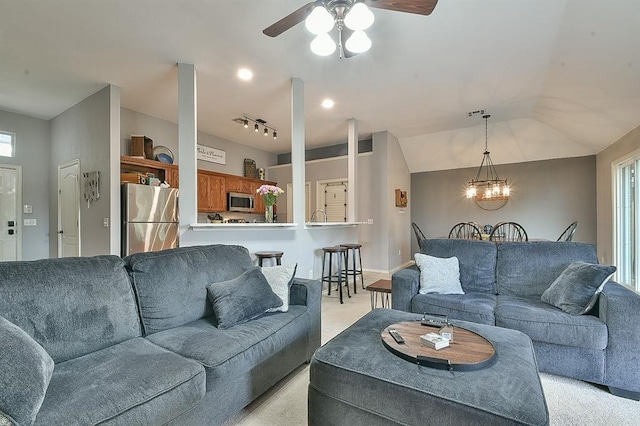 4616 Midway Dr, Norman, OK 73072 - living room featuring light carpet, ceiling fan, a chandelier, and lofted ceiling