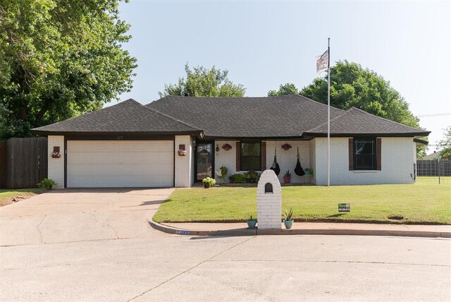 117 W Meade Dr, Yukon, OK 73099 - single story home featuring concrete driveway, an attached garage, brick siding, and a shingled roof