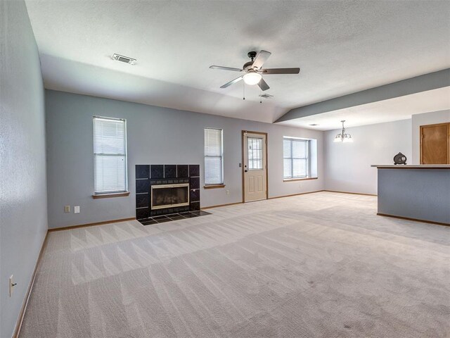 321 Bradgate Dr, Yukon, OK 73099 - unfurnished living room featuring light carpet, a fireplace, and ceiling fan