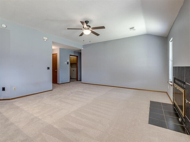 321 Bradgate Dr, Yukon, OK 73099 - unfurnished living room featuring a ceiling fan, carpet floors, and lofted ceiling