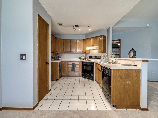 321 Bradgate Dr, Yukon, OK 73099 - kitchen with electric range, black dishwasher, under cabinet range hood, a peninsula, and light countertops