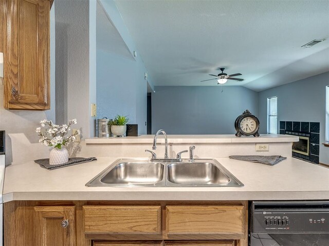 321 Bradgate Dr, Yukon, OK 73099 - kitchen featuring black dishwasher, a ceiling fan, light countertops, and brown cabinets