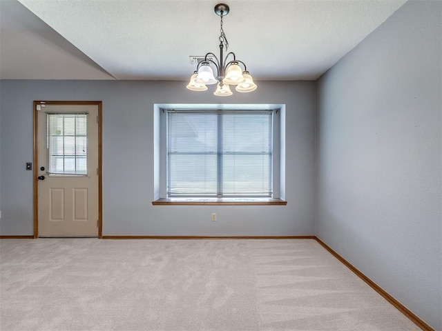 321 Bradgate Dr, Yukon, OK 73099 - unfurnished dining area with a chandelier and light colored carpet