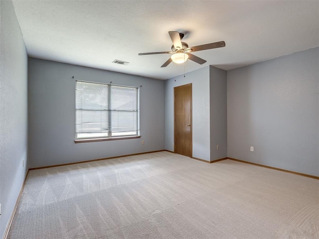 321 Bradgate Dr, Yukon, OK 73099 - empty room with ceiling fan and light colored carpet