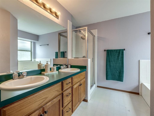 321 Bradgate Dr, Yukon, OK 73099 - bathroom featuring a stall shower, double vanity, a garden tub, and tile patterned floors