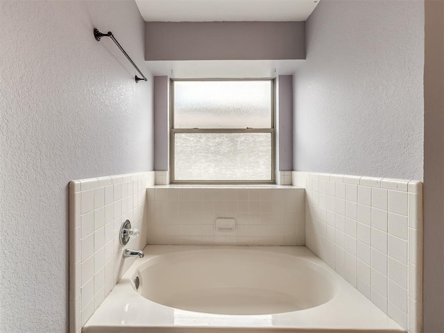 321 Bradgate Dr, Yukon, OK 73099 - full bath with a textured wall and a garden tub