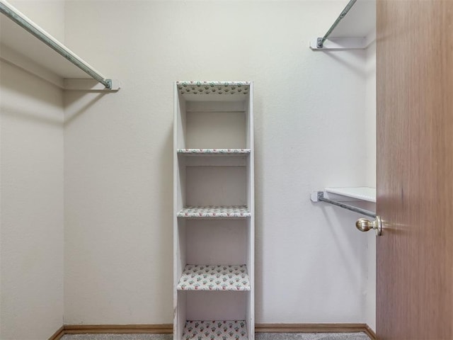 321 Bradgate Dr, Yukon, OK 73099 - spacious closet featuring carpet