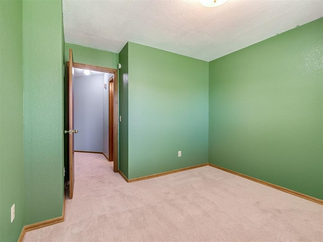 321 Bradgate Dr, Yukon, OK 73099 - unfurnished bedroom featuring carpet flooring and a textured ceiling