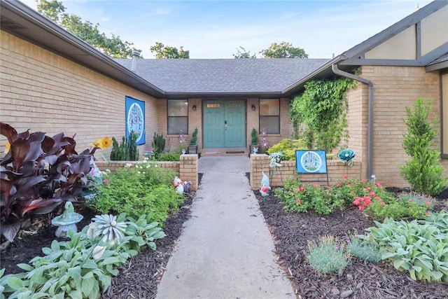 4213 NE 143rd St, Edmond, OK 73013 - property entrance with brick siding and roof with shingles