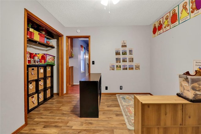 4213 NE 143rd St, Edmond, OK 73013 - office with a textured ceiling and light wood finished floors
