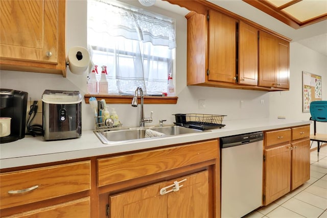 4213 NE 143rd St, Edmond, OK 73013 - kitchen featuring dishwasher, light tile patterned floors, light countertops, and brown cabinets