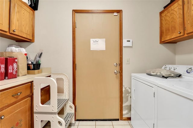 4213 NE 143rd St, Edmond, OK 73013 - laundry room featuring cabinet space, washer and dryer, and light tile patterned floors