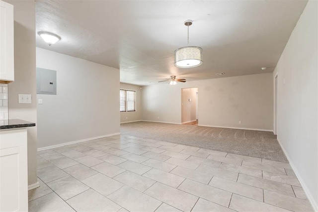 300 Yukon Ave, Yukon, OK 73099 - spare room featuring electric panel, a ceiling fan, and light tile patterned flooring