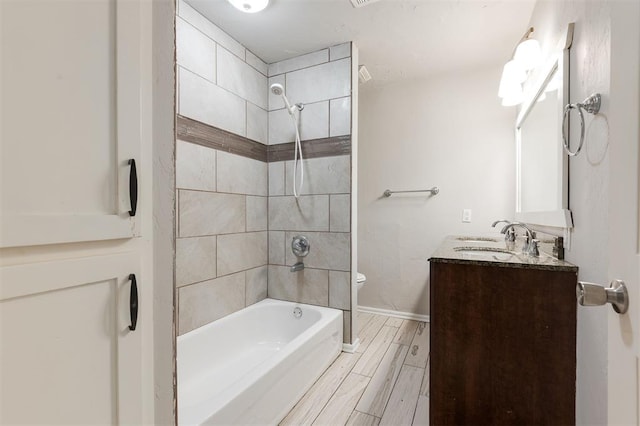300 Yukon Ave, Yukon, OK 73099 - full bathroom featuring vanity,  shower combination, and wood tiled floors